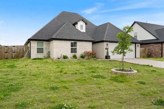 view of front facade featuring a garage, fence, and brick siding