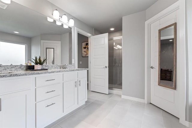 bathroom with vanity, baseboards, recessed lighting, tile patterned floors, and a shower stall