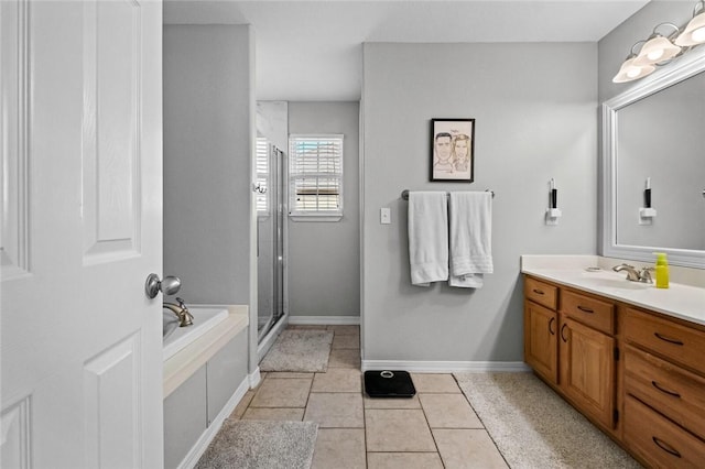 bathroom featuring vanity, a stall shower, tile patterned floors, and a bath