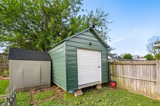 view of shed featuring a fenced backyard