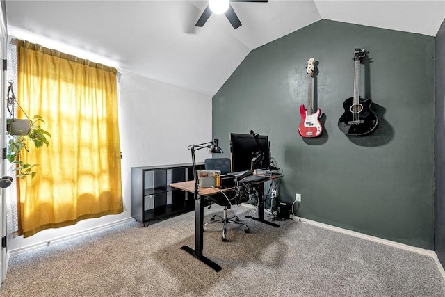 carpeted home office featuring ceiling fan and vaulted ceiling
