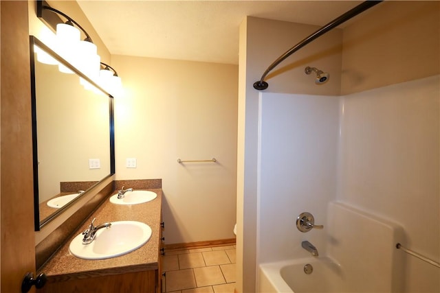 bathroom featuring shower / bathtub combination, tile patterned floors, and a sink