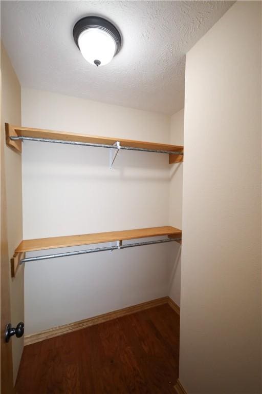 spacious closet with wood finished floors