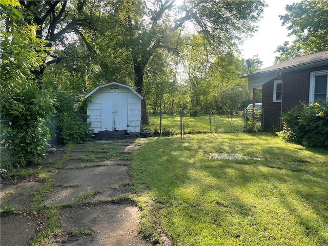 607 Carter St, Clarksville, AR 72830 - view of yard featuring fence, a storage unit, an outbuilding, and a gate