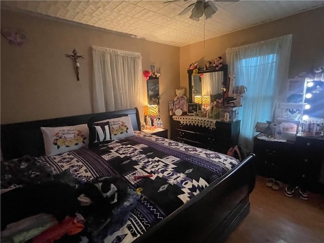 607 Carter St, Clarksville, AR 72830 - bedroom featuring a ceiling fan and wood finished floors