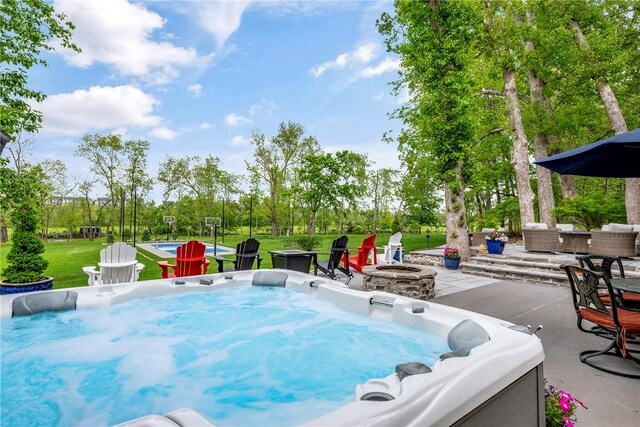 4107 W Seminole Dr, Rogers, AR 72758 - view of pool with a patio, a hot tub, an outdoor fire pit, and a yard