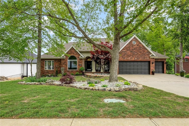 4107 W Seminole Dr, Rogers, AR 72758 - view of front of home featuring an attached garage, driveway, brick siding, and a front yard