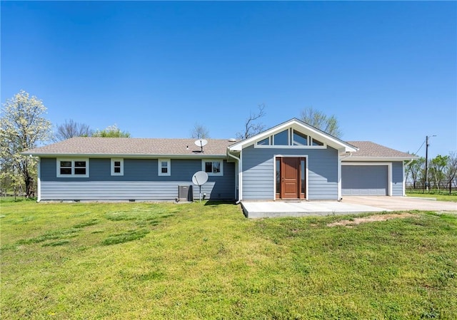 view of front of house featuring a garage and a front lawn