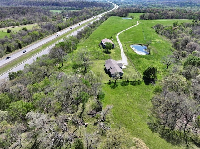 bird's eye view featuring a water view and a rural view