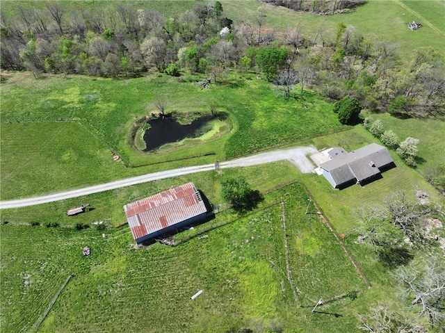 birds eye view of property with a rural view