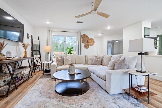 living room featuring recessed lighting, a ceiling fan, light wood-type flooring, and visible vents