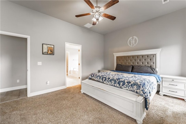 carpeted bedroom featuring baseboards, a ceiling fan, and connected bathroom