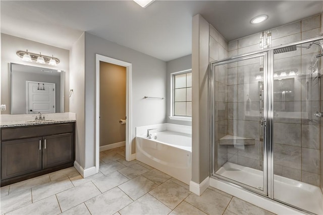full bath with vanity, tile patterned flooring, baseboards, a bath, and a shower stall