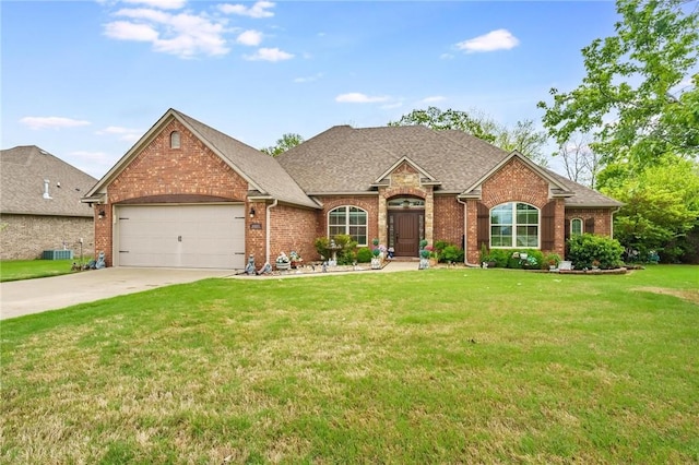 single story home featuring brick siding, a garage, a front lawn, and driveway