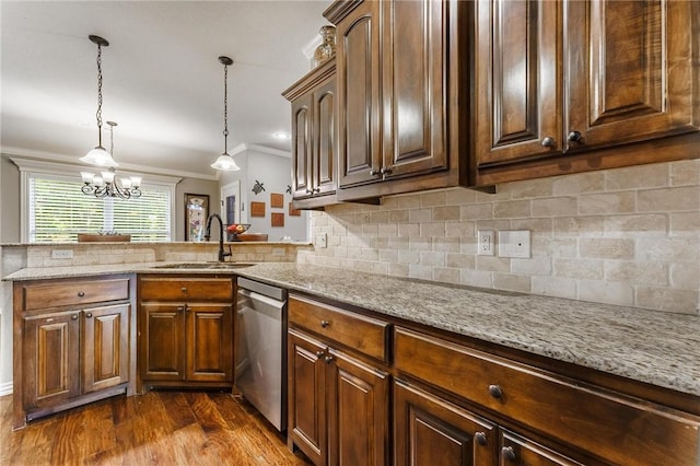 kitchen featuring an inviting chandelier, a sink, dark wood-type flooring, stainless steel dishwasher, and ornamental molding
