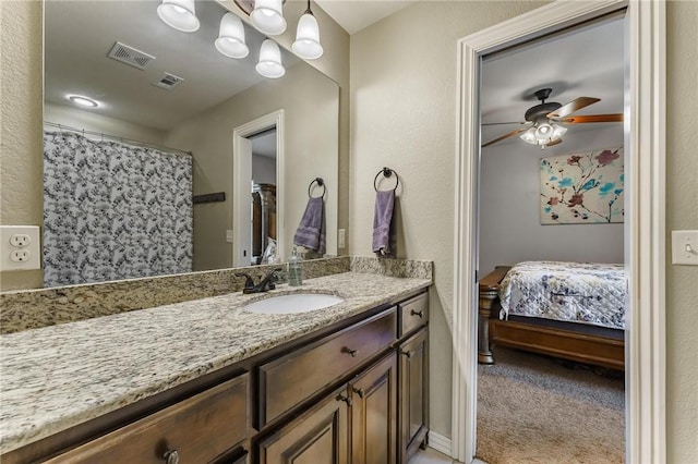 bathroom featuring visible vents, a ceiling fan, connected bathroom, and vanity