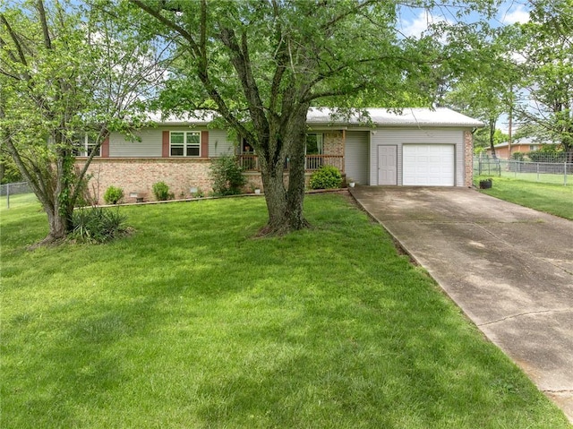 ranch-style house featuring brick siding, a garage, and fence