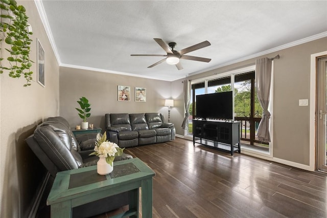 living area with crown molding, ceiling fan, baseboards, wood finished floors, and visible vents