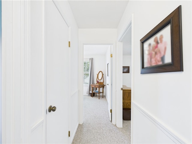 hall with light carpet