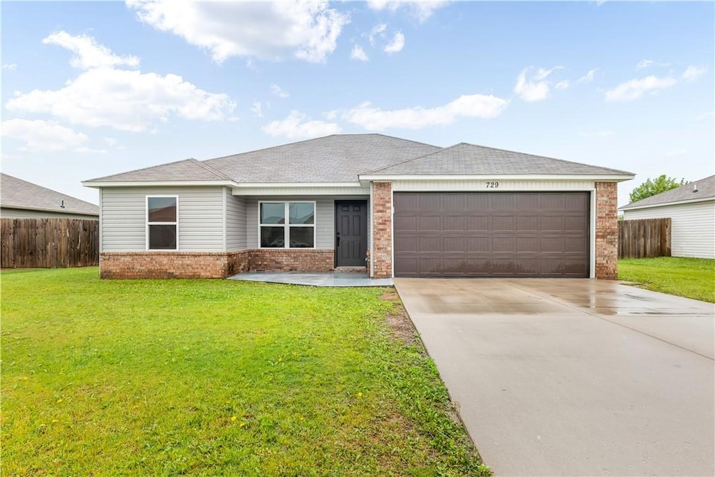 729 NW 68th Ave, Bentonville, AR 72713 - single story home featuring concrete driveway, brick siding, fence, and a garage