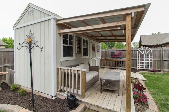 203 W Hayden Blvd, Rogers, AR 72756 - view of outdoor structure with a fenced backyard and outdoor lounge area