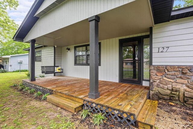 view of exterior entry featuring stone siding