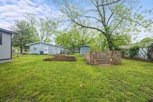 view of yard featuring a garden and fence