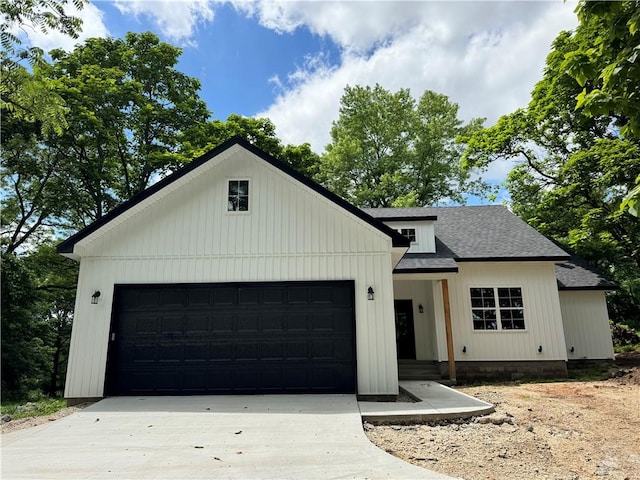 13537 Little Elm Rd, Farmington, AR 72730 - modern farmhouse style home featuring concrete driveway, a garage, and roof with shingles
