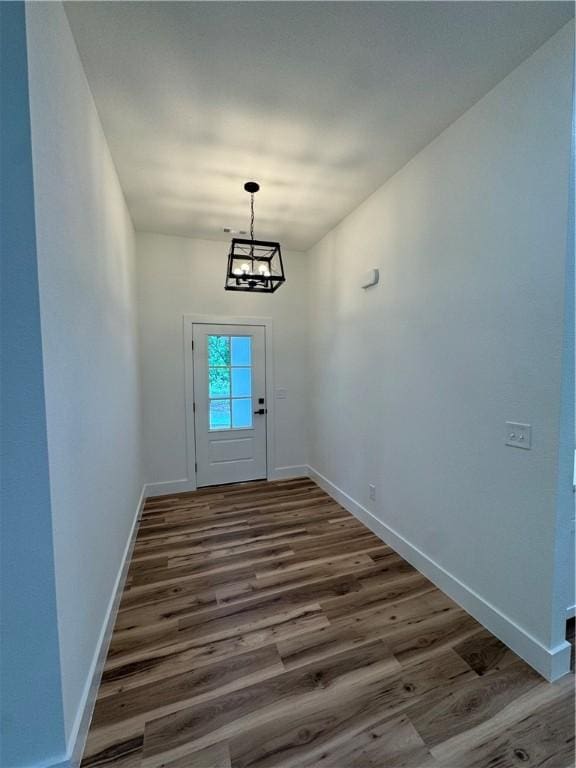 13537 Little Elm Rd, Farmington, AR 72730 - entryway featuring wood finished floors, baseboards, and a chandelier