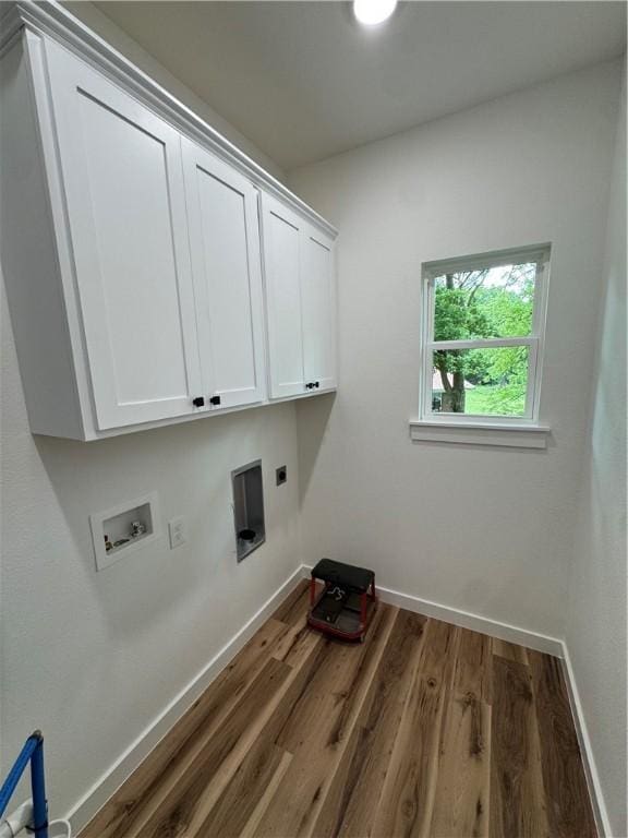 13537 Little Elm Rd, Farmington, AR 72730 - laundry room with cabinet space, wood finished floors, hookup for an electric dryer, baseboards, and washer hookup