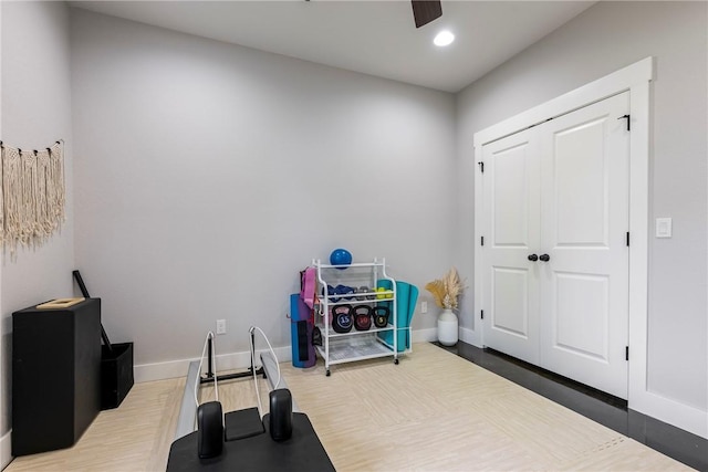 workout room featuring baseboards, a ceiling fan, recessed lighting, and wood finished floors
