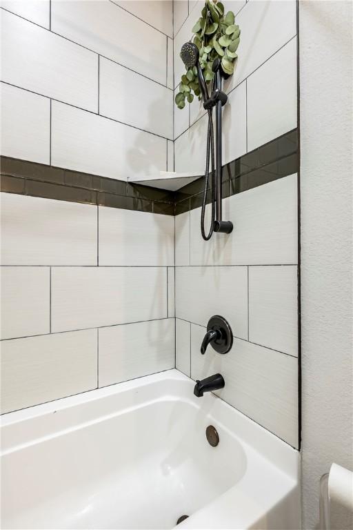 full bath featuring washtub / shower combination