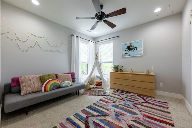 game room with baseboards, a ceiling fan, recessed lighting, and light carpet