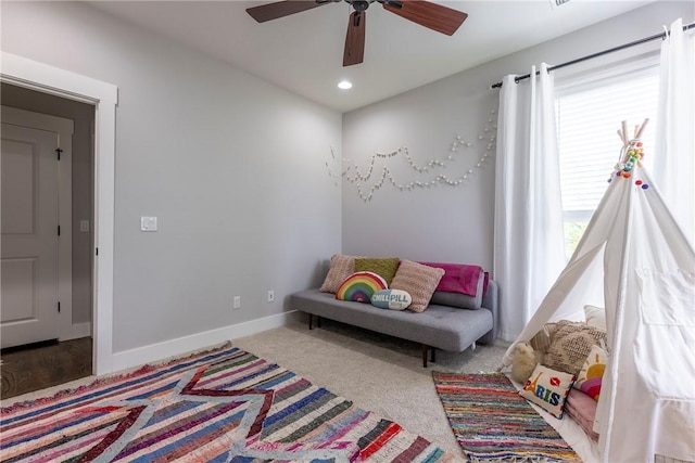 living area featuring baseboards, a ceiling fan, recessed lighting, and carpet floors
