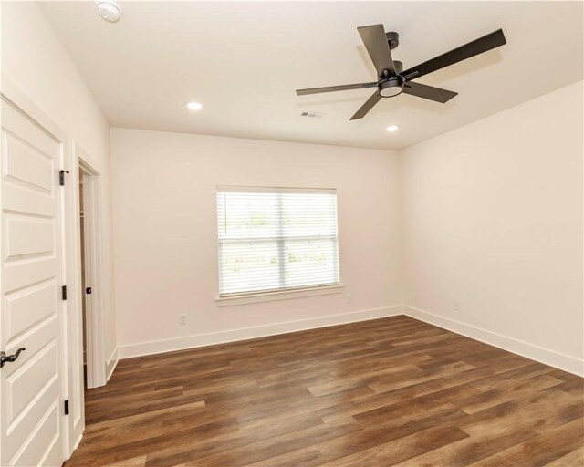 unfurnished bedroom with baseboards, visible vents, and wood finished floors
