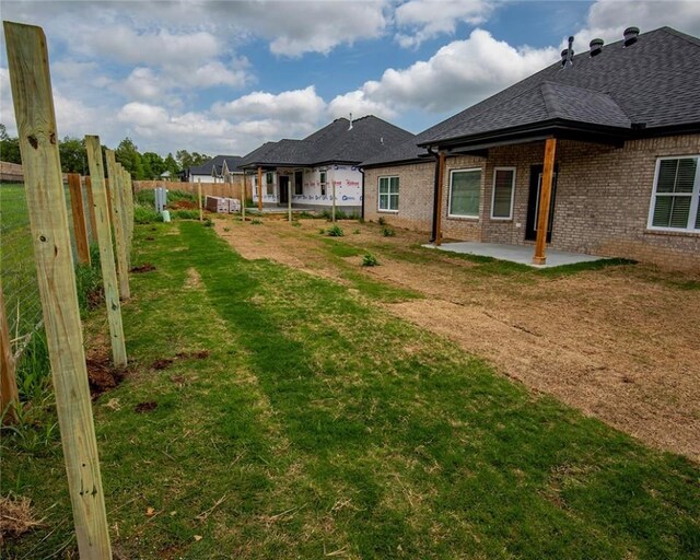 view of yard with fence and a patio area