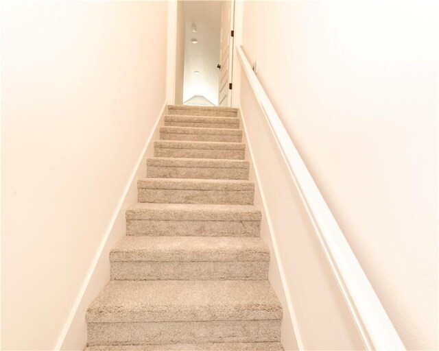 stairway with carpet floors