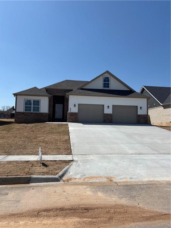 view of front of home featuring a garage and concrete driveway