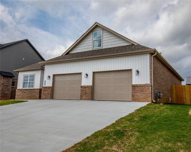 212 Nebo St, Prairie Grove, AR 72753 - view of front of house with board and batten siding, brick siding, fence, an attached garage, and concrete driveway