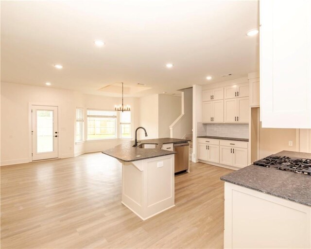 212 Nebo St, Prairie Grove, AR 72753 - kitchen featuring white cabinets, recessed lighting, light wood-style flooring, and a sink
