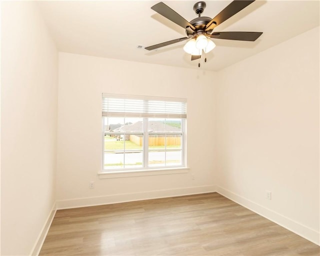 212 Nebo St, Prairie Grove, AR 72753 - unfurnished room featuring light wood finished floors, baseboards, and a ceiling fan