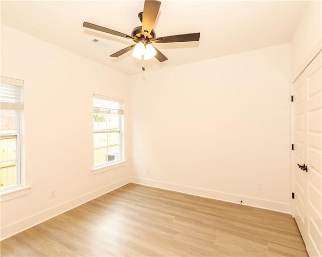212 Nebo St, Prairie Grove, AR 72753 - spare room featuring ceiling fan, light wood-style flooring, and baseboards