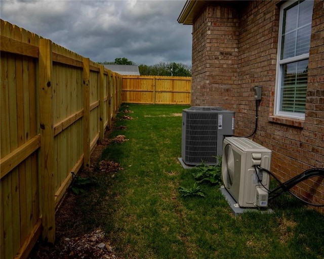 212 Nebo St, Prairie Grove, AR 72753 - view of yard featuring cooling unit, a fenced backyard, and ac unit