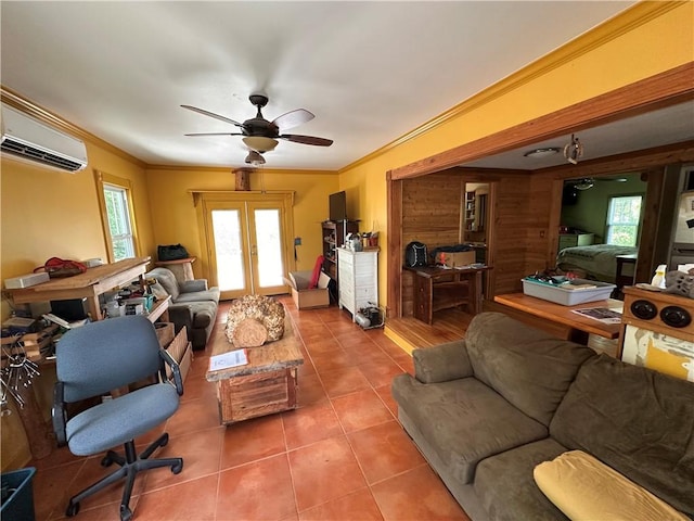 tiled living room featuring french doors, a ceiling fan, a wall mounted AC, wooden walls, and ornamental molding