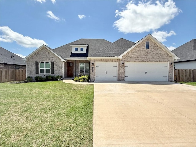 view of front of house with a garage, a front lawn, fence, brick siding, and concrete driveway
