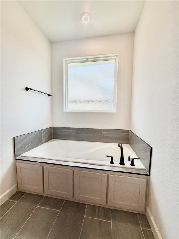 bathroom with a garden tub