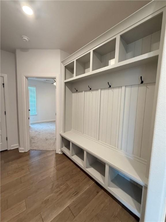 mudroom with baseboards and wood finished floors