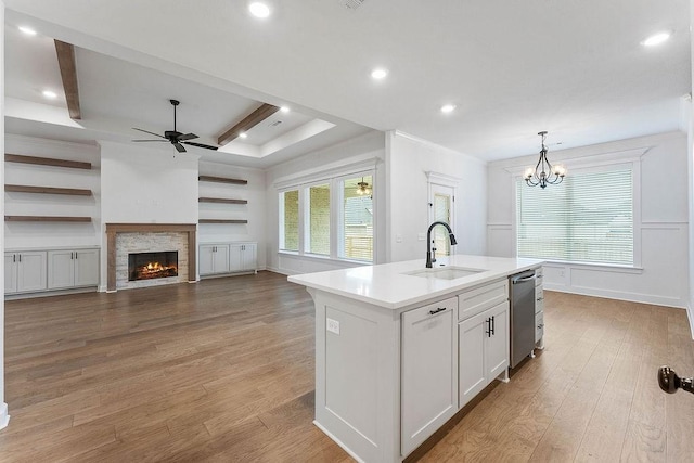 909 Budrio Ave, Tontitown, AR 72762 - kitchen featuring a sink, dishwasher, a ceiling fan, light wood-style floors, and recessed lighting