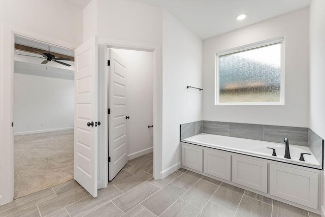 909 Budrio Ave, Tontitown, AR 72762 - bathroom featuring a garden tub, baseboards, ceiling fan, and recessed lighting