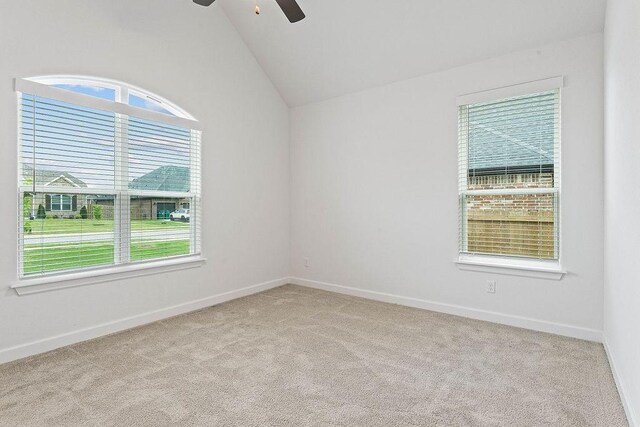 909 Budrio Ave, Tontitown, AR 72762 - spare room with ceiling fan, carpet floors, vaulted ceiling, and baseboards
